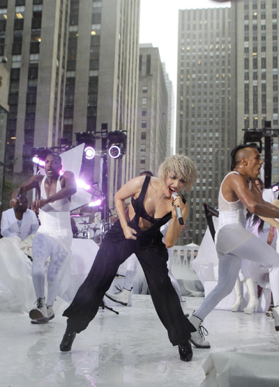 Lady Gaga performs during a rain shower on NBC's 