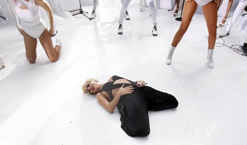 Lady Gaga performs during a rain shower on NBC's 