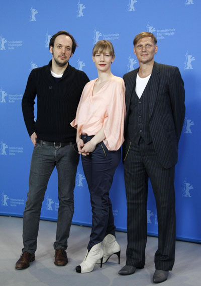 Director Schomburg poses with cast members during photocall at the Berlin Film Festival