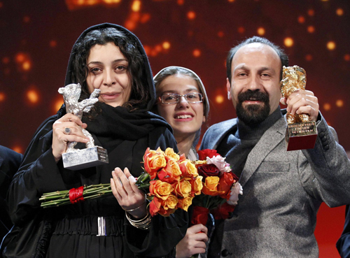 Members of the film 'Jodaeiye Nadar Az Simin'receive the Golden Bear aword for best film