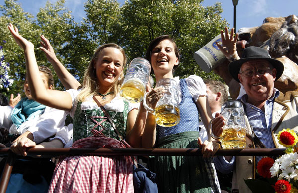 People in traditional Bavarian clothes take part in the Parade of the Landlords and Breweries during the opening of the 178th Oktoberfest in Munich September 17, 2011. World's biggest beer fest opens in Munich
