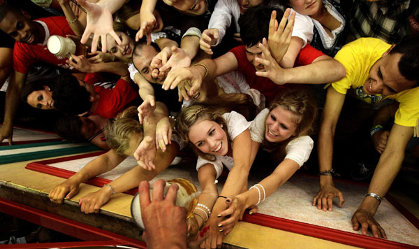 Revellers scuffle for the first free beer in the traditional 1-litre beer mug at the opening of the world's biggest beer fest, the Munich Oktoberfest, at the Theresienwiese in Munich, September 17, 2011. World's biggest beer fest opens in Munich