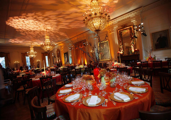 The table settings for a State Dinner hosted by US President Barack Obama for South Korea's President Lee Myung-bak are shown during a press preview in the East Room of the White House in Washington, Oct 13, 2011. Obama, Lee hail long-sought trade deal