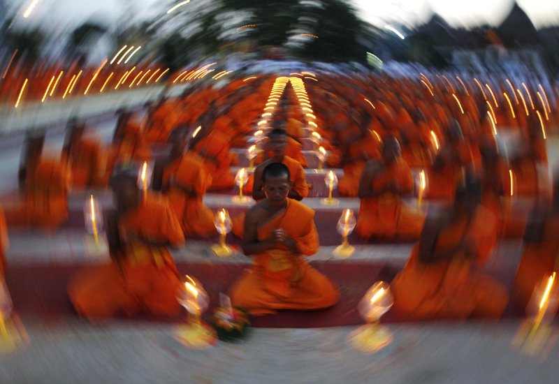 Buddhists monks pray at a temple in Suphan Buri province Jan 9, 2013. Buddhist monks were attending a traditional pilgrimage to pay homage to Lord Buddha and bless Thailand as it enters the new year. Buddhist monks pray for new year in Thailand