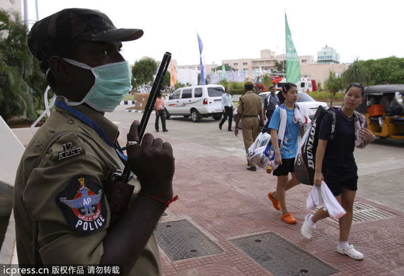 An Indian police officer stands guard at Gachibowli stadium in Hyderabad, India, Aug 10, 2009. Attacks and threats affected sporting events in history