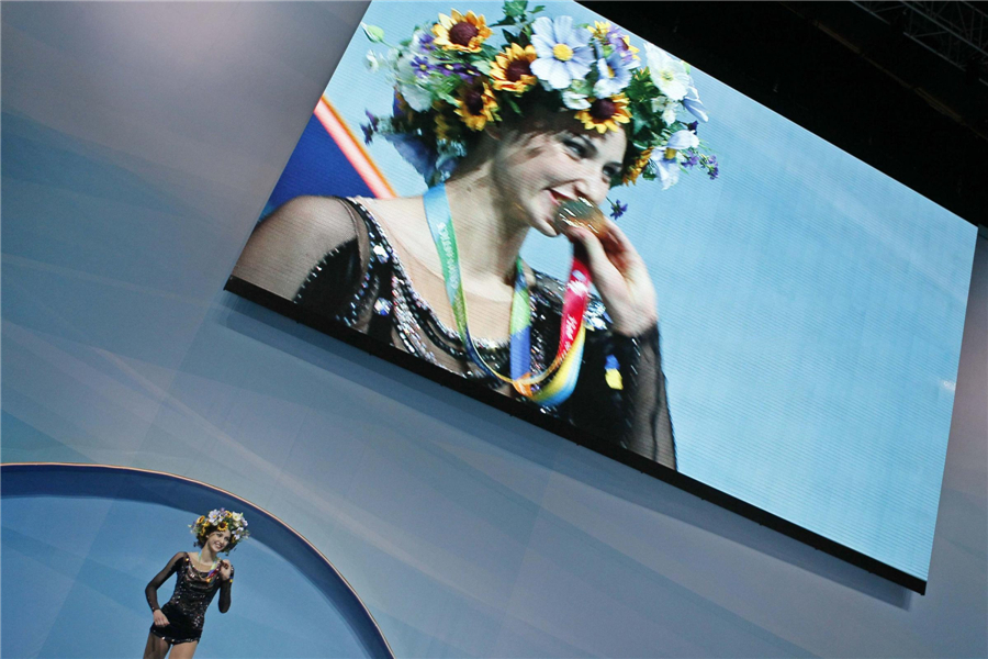 Ganna Rizatdinova of Ukraine kisses her medal during an awarding ceremony after the individual hoop competition final at the 32nd Rhythmic Gymnastics World Championships in Kiev, Aug 28, 2013. Moments from 32nd rhythmic gymnastics worlds