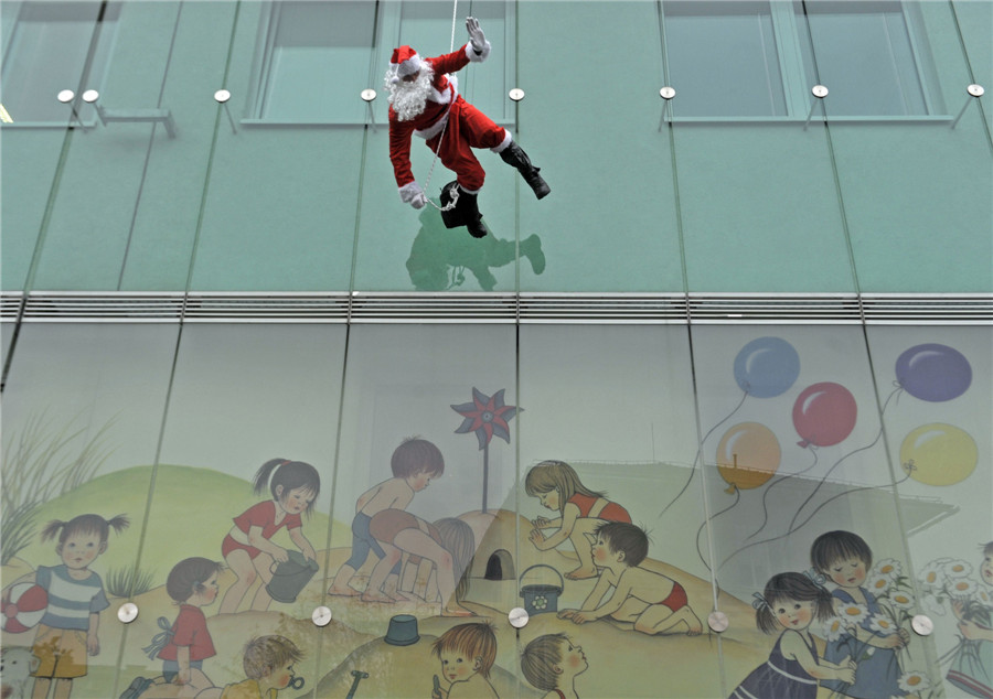 Police dressed as Santa perform for patients