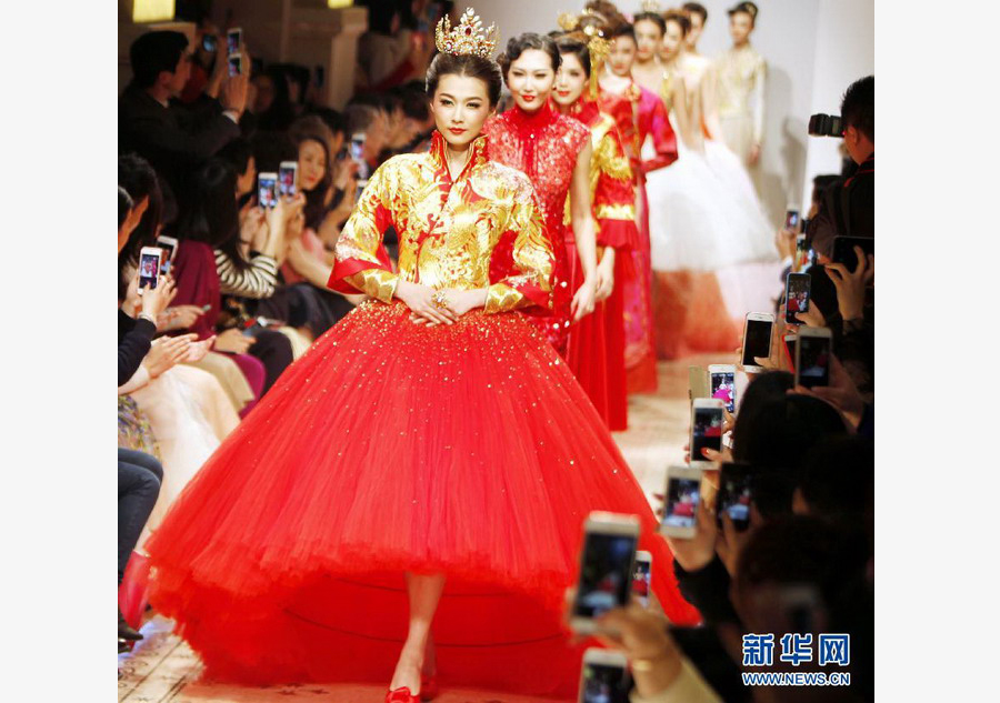 Models present Guo Pei's creations at Shanghai fashion week