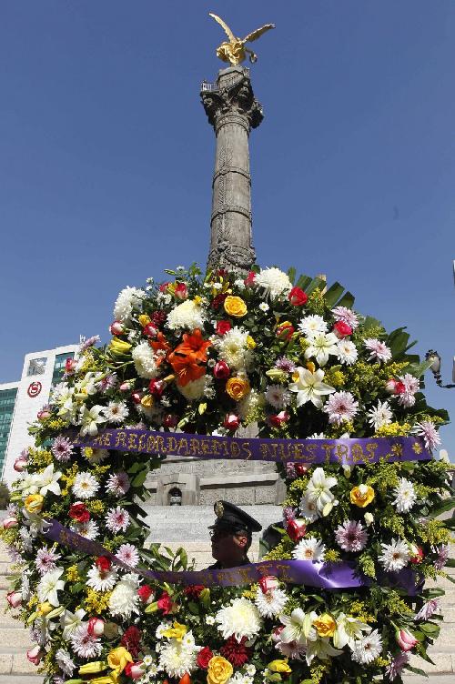 各地民眾紀念海地地震一周年