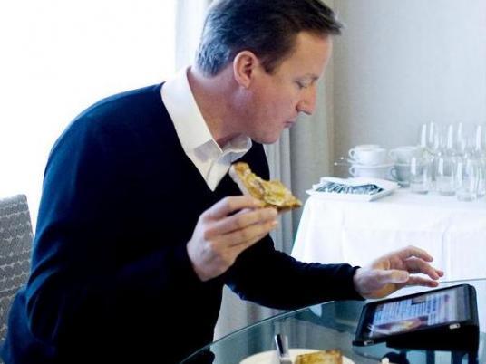 “蘋果迷”卡梅倫對iPad愛不釋手 用定制軟件管理國家事務