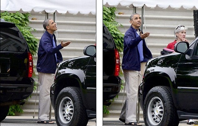 奧巴馬出門前伸手測雨 或因海軍撐傘風(fēng)波心有余悸