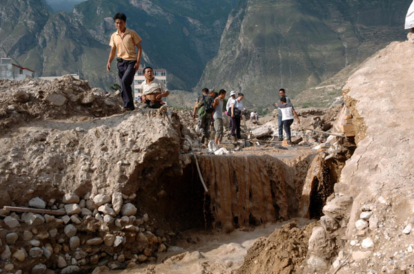 Frantic search for signs of life after landslide