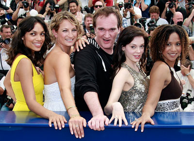 U.S. director Quentin Tarantino (C) poses with cast members, from L-R, Rosario Dawson, Zoe Bell, Rose McGowan and Tracie Thoms during a photocall for his film