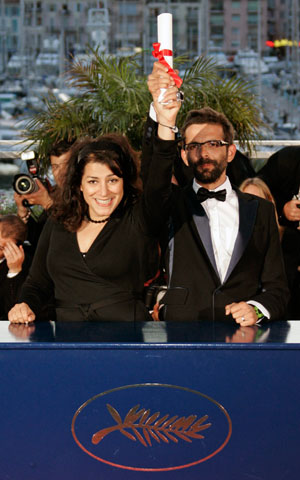 Directors Marjane Satrapi (L) of Iran and Vincent Paronnaud of France hold the Jury Prize for their film