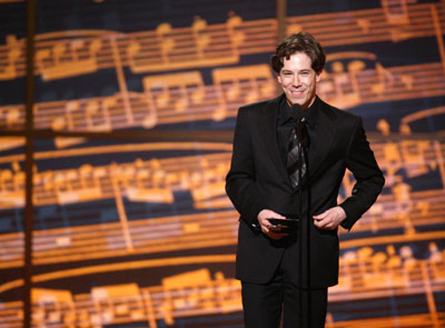 Actor John Gallagher Jr. speaks after receiving the award for Best Performance by a Featured Actor in a Musical for his work in