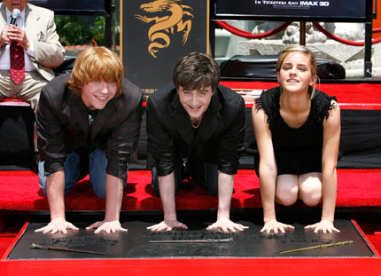 Cast members Daniel Radcliffe (C), Rupert Grint (L) and Emma Watson from the movie
