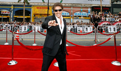 Cast member Al Pacino waves as he arrives at the premiere of