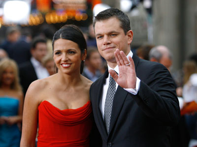 Cast member Matt Damon waves next to his wife Luciana at the premiere of