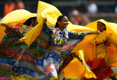Venezuelan dancers perform before the start of the Copa America soccer final between Argentina and Brazil in Maracaibo July 15, 2007.
