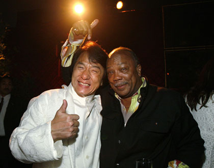 Cast member Jackie Chan (L) poses with Quincy Jones at the after party for the premiere of
