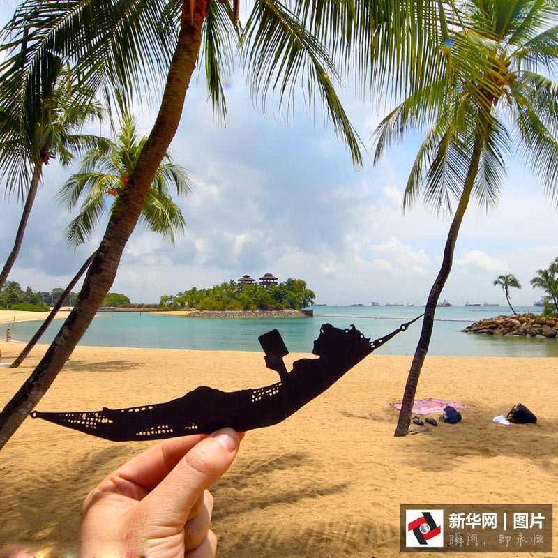 藝術(shù)家剪紙錯(cuò)位攝影 度假勝地變創(chuàng)意作品趣味十足(組圖)