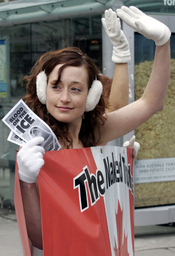 PETA members protest in Toronto and Bangkok