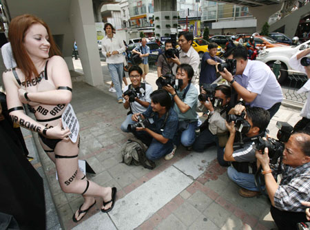 PETA members protest in Toronto and Bangkok