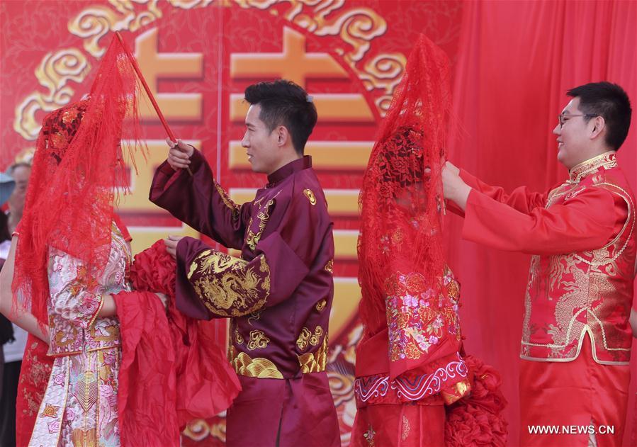 Look of love: Many Chinese couples get married on May 20