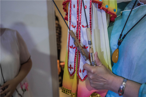 人在世博丨“翻作花間舞 偶旋扇底風”