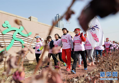 Women enter a walking race on their day