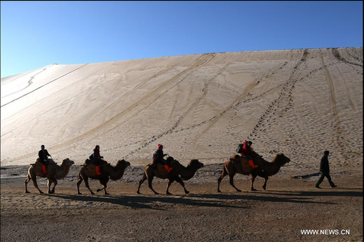 Scenery of crescent spring of Mingsha Hill in Dunhuang