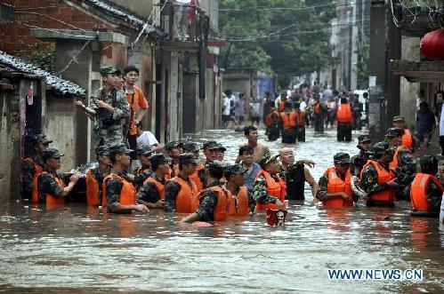 Stranded residents evacuated to safe place in flooded Guangshui City