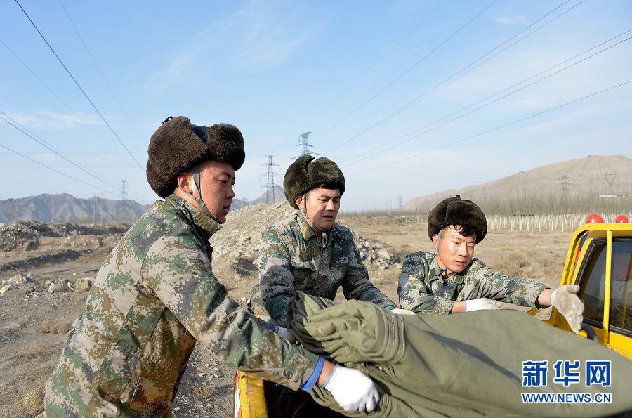 Electricians work on power lines in Wuhai