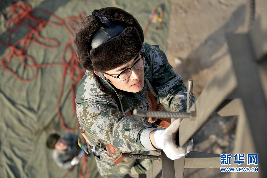 Electricians work on power lines in Wuhai