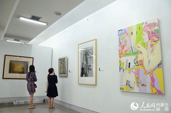 Fine arts created by college instructors on display