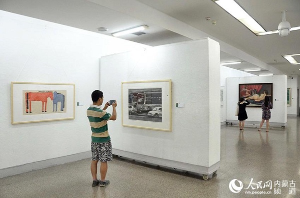 Fine arts created by college instructors on display