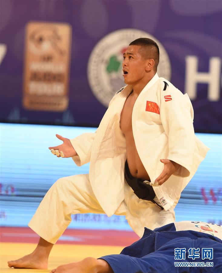 Saiyin Jirigala gives home crowd China's first gold medal