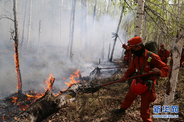 Firefighters weaken flames in northern forest