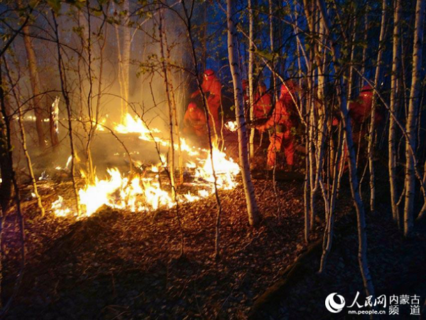 Firefighters weaken flames in northern forest
