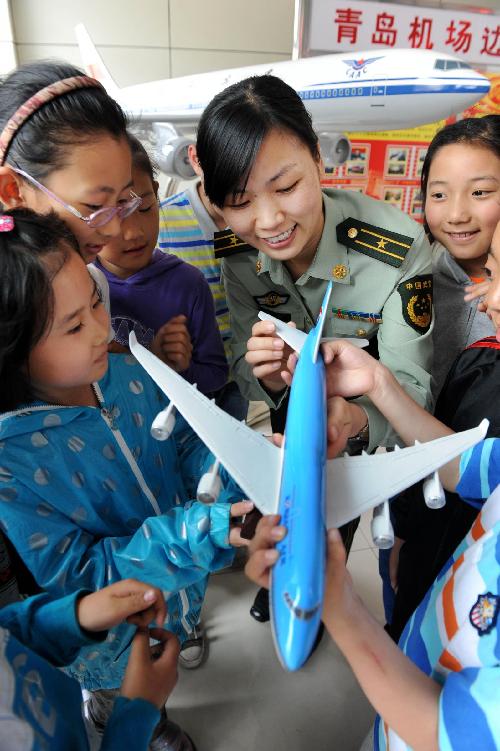 Children celebrate coming holiday at airport
