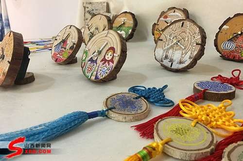 Graduates display art creations at an exhibition