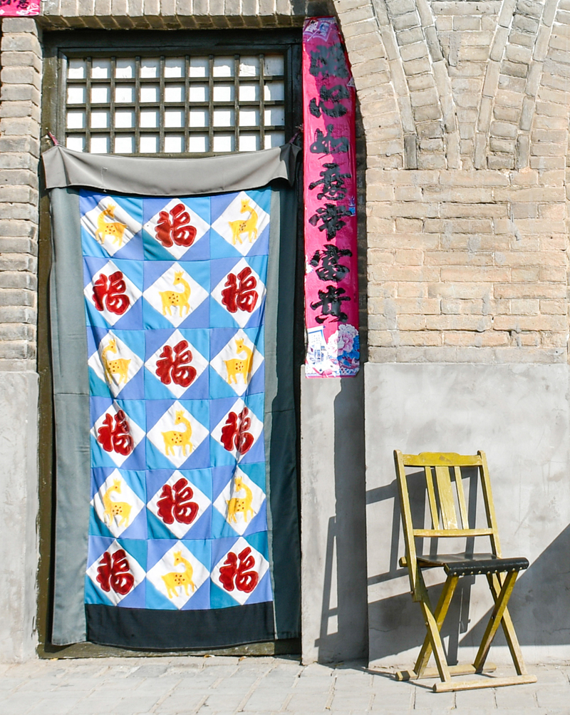 Patchwork winter door covers brighten North China homes