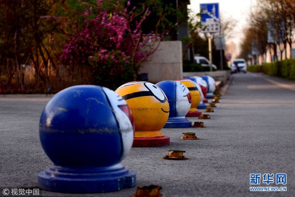 Cartoon road barriers decorate street in Shenyang