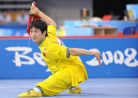 Zhao Qingjian of China performs during men's Daoshu (broadsword play) of the Beijing 2008 Wushu Competition in Beijing, China, Aug. 21, 2008. Zhao Qingjian ranked 1st in men's Daoshu competition with a score of 9.85. (Xinhua/Chen Yehua)