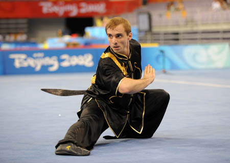 Andrzej Topczewski of Poland performs during men's Daoshu (broadsword play) of the Beijing 2008 Wushu Competition in Beijing, China, Aug. 21, 2008. Andrzej Topczewski ranked 9th in men's Daoshu competition with a score of 9.25. (Xinhua/Chen Yehua)