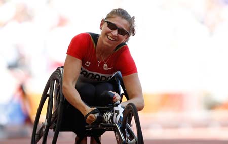 Canada&apos;s Michelle Stilwell reacts after women&apos;s 200M T52 final at the National Stadium，also known as the Bird&apos;s Nest，during the Beijing 2008 Paralympic Games in Beijing, Sept. 11, 2008. Stilwell won the gold medal with 36.18 seconds.(