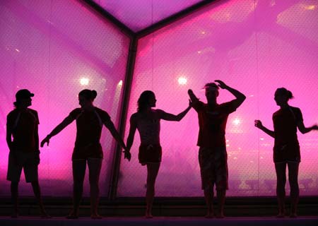 Canadian swimmers pose for group photos in the National Aquatics Center, or the Water Cube, in Beijing, China, Sept. 15, 2008. The Beijing 2008 Paralympic Games swimming event finished here on Tuesday.