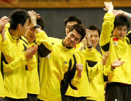 World number one Lin Dan of China (C) celebrates with his team mates atop the victory podium during the prize presentation ceremony at the Thomas Cup badminton tournament in Tokyo May 7, 2006. China beat Denmark at the finals.