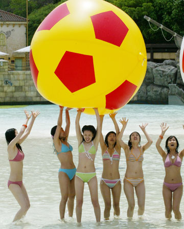 South Korean models pose with soccer balls during a promotional drive wishing South Korean soccer team's success in the 2006 Germany World Cup at Caribbean Bay swimming pool in South Korea's largest amusement park Everland in Yongin, about 50 km (31 miles) south of Seoul, May 11, 2006.
