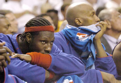 Detroit Pistons players Ben Wallace (L) and Chauncey Billups react during the final minutes of play against the Miami Heat during Game 6 of the NBA Eastern Conference Finals in Miami June 2, 2006.